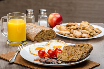 Breakfast- bacon, sausage, bread and eggs