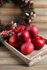 Christmas apples on wooden table