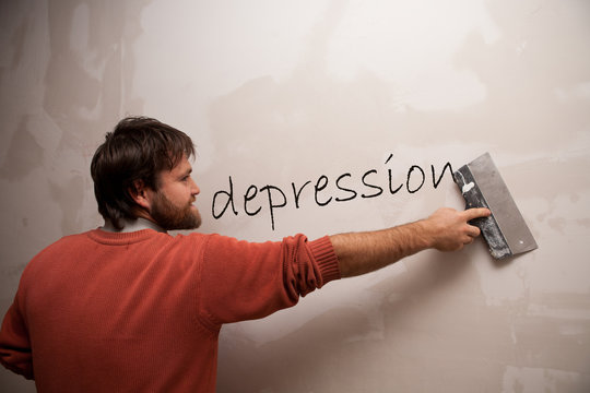 man with a spatula deleting the word Depression