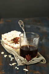 Glass of espresso and tasty homemade pie on wooden table