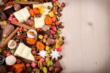 Obraz na płótnie Canvas Wood background with sweets and chocolate