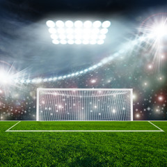 Soccer ball on green stadium arena
