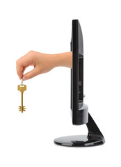 Computer screen and hand with key