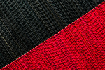 Red and black bamboo mat texture or background