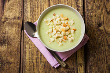 Broccoli cream soup and dried crusts, top view