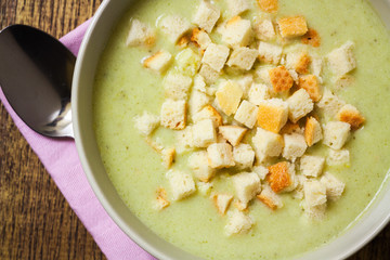 Broccoli cream soup and dried crusts, top view