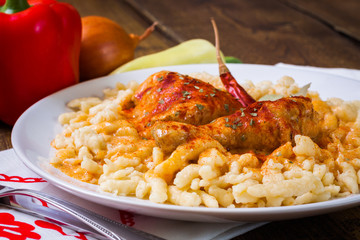 Traditional hungarian chicken paprikash with noodles