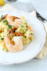 Tasty couscous with shrimp on the plate