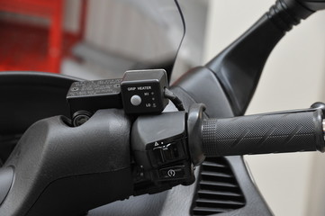 Heated grips on a scooter