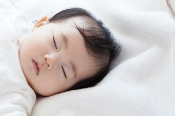 Obraz na płótnie Canvas お昼寝する赤ちゃん
