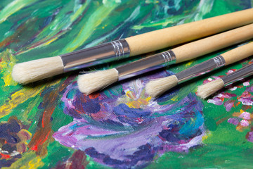 close up of acrylic paint and paint brushes set