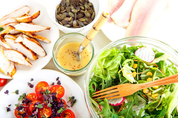 Salad with grilled meat, smoked fish and different vegetables.