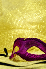 Vintage carnival mask in golden background with copy space