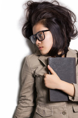 Top view of designer woman with glasses and book.