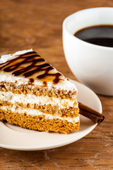 chocolate cake on a plate and black coffee