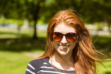 Beautiful young woman wearing sunglasses