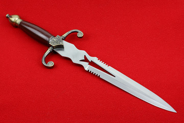 Fantasy style dagger  on a red background