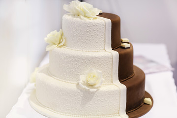 Delicious beautiful wedding cake in white and brown.