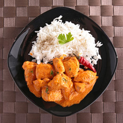 chicken cooked with curry and rice