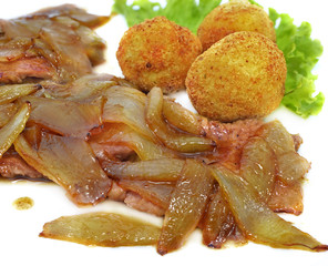 Strip steak with onion and potato croquettes