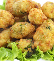 Potato croquettes fried with herbs, close up