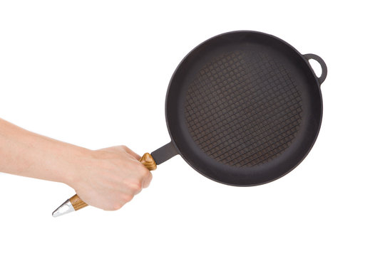 Hand holding a pan
