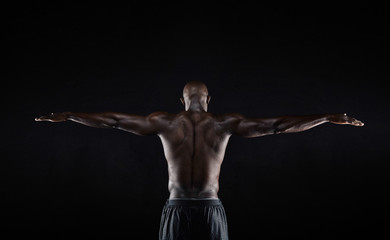 Fototapeta na wymiar Strong back of a black muscular man