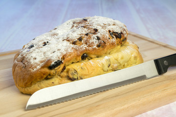 Currant bread on a wooden cutting board
