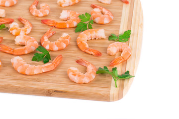 Boiled shrimps on cutting board.