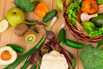 Vegetables on a wooden table in the closeup.