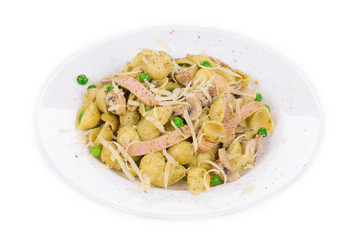 Pasta with pesto sauce peas and nuts.