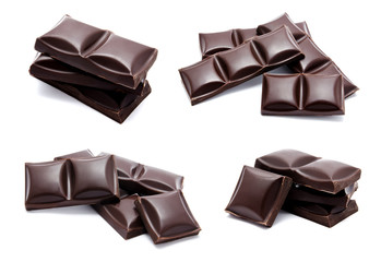 Dark chocolate bars stack with crumbs isolated