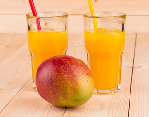 Mango juice with mango in the closeup.