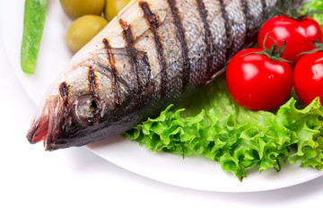 Grilled fish with vegetables.