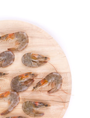Fresh shrimps on round board.