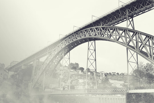 Dom Luiz bridge in the fog. Vintage picture. Porto, Portugal