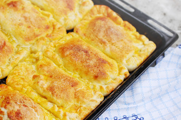 homemade pies on a baking sheet