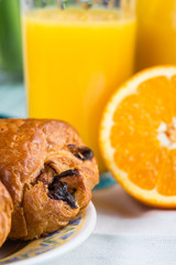 Fresh croissant with orange juice