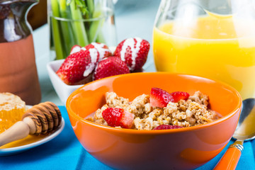 Continental breakfast with fresh orange juice and strawberries