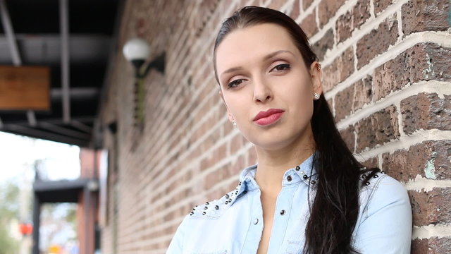 Close up of young Latvian entrepreneur woman in front of store
