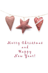 Hand made hearts and a star hanging on the wall