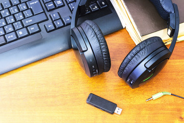 Fototapeta na wymiar Headphones and computer keyboard