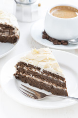 piece of chocolate cake with butter cream and coffee