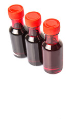Liquid deep red food color additive over white background