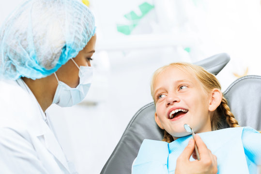 Dentist inspecting patient