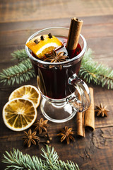 Mulled wine and spices on wooden background. Selective focus