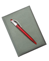 Red Pen on a dark notebook