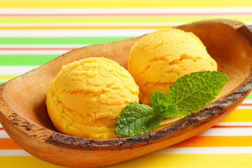 Ice cream served in natural wood bowl