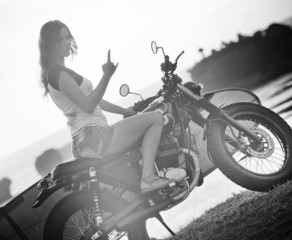 Fototapeta na wymiar Girl on motorcycle