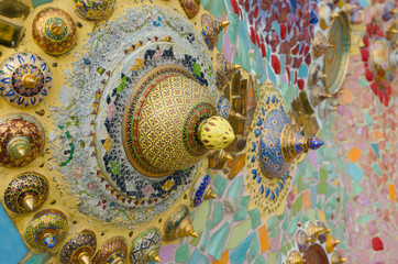 Thai Benjarong bowl on tile mosaic background.